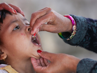 A Nepali child receives a ''Vitamin A'' capsule at an inoculation center in Kathmandu, Nepal, on October 18, 2024. (