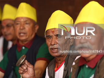 Elderly members of the local Newa: community sing hymns during Hadigaun Jatra in Kathmandu, Nepal, on October 18, 2024. (