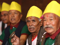 Elderly members of the local Newa: community sing hymns during Hadigaun Jatra in Kathmandu, Nepal, on October 18, 2024. (