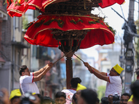 Devotees rotate the chariot of Lord Satya Narayan while celebrating the Hadigaun Jatra in Kathmandu, Nepal, on October 18, 2024. (