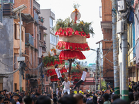 Devotees rotate the chariot of Lord Satya Narayan while celebrating the Hadigaun Jatra in Kathmandu, Nepal, on October 18, 2024. (