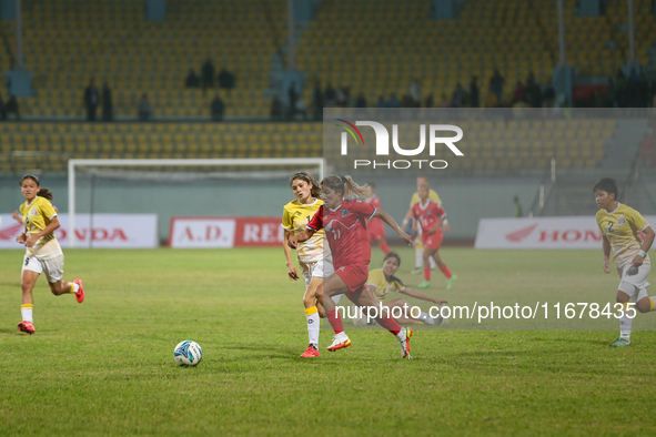 Players of Nepal and Bhutan play against each other during the SAFF Women's Championship 2024 in Kathmandu, Nepal, on October 18, 2024. Nepa...