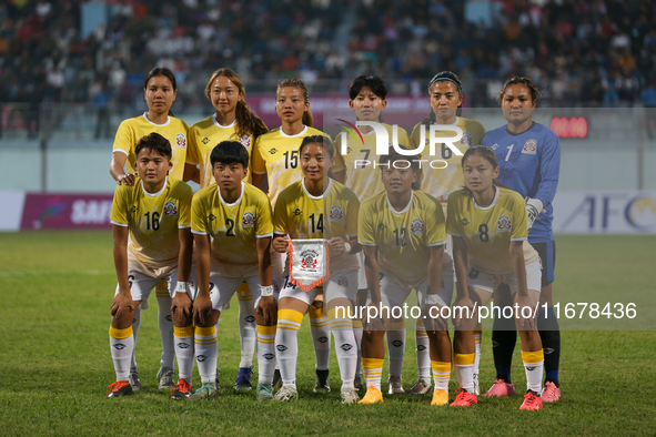 Team Bhutan poses for a photo before the formal start of the match with Nepal in the ongoing SAFF Women's Championship 2024 in Kathmandu, Ne...