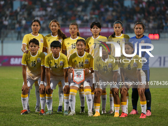 Team Bhutan poses for a photo before the formal start of the match with Nepal in the ongoing SAFF Women's Championship 2024 in Kathmandu, Ne...