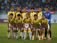 Team Bhutan poses for a photo before the formal start of the match with Nepal in the ongoing SAFF Women's Championship 2024 in Kathmandu, Ne...