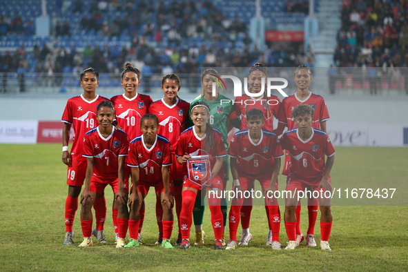 Team Nepal poses for a photo before the formal start of the match with Bhutan in the ongoing SAFF Women's Championship 2024 in Kathmandu, Ne...