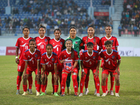 Team Nepal poses for a photo before the formal start of the match with Bhutan in the ongoing SAFF Women's Championship 2024 in Kathmandu, Ne...