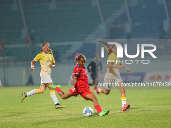 Players of Nepal and Bhutan play against each other during the SAFF Women's Championship 2024 in Kathmandu, Nepal, on October 18, 2024. Nepa...