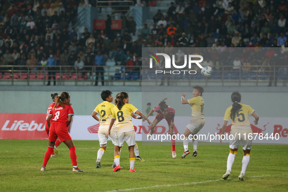 Players of Nepal and Bhutan play against each other during the SAFF Women's Championship 2024 in Kathmandu, Nepal, on October 18, 2024. Nepa...