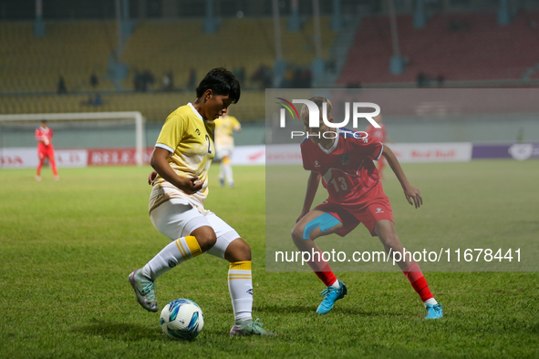 Players of Nepal and Bhutan play against each other during the SAFF Women's Championship 2024 in Kathmandu, Nepal, on October 18, 2024. Nepa...