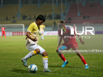 Players of Nepal and Bhutan play against each other during the SAFF Women's Championship 2024 in Kathmandu, Nepal, on October 18, 2024. Nepa...