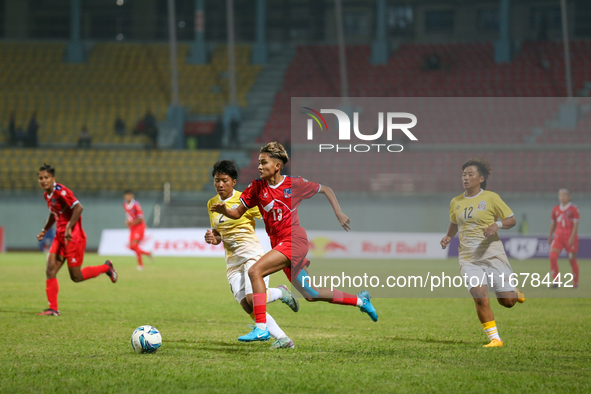 Players of Nepal and Bhutan play against each other during the SAFF Women's Championship 2024 in Kathmandu, Nepal, on October 18, 2024. Nepa...