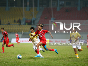 Players of Nepal and Bhutan play against each other during the SAFF Women's Championship 2024 in Kathmandu, Nepal, on October 18, 2024. Nepa...