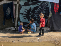 Displaced Palestinians are in Deir al-Balah in the central Gaza Strip on October 18, 2024, amid the ongoing war between Israel and the Pales...