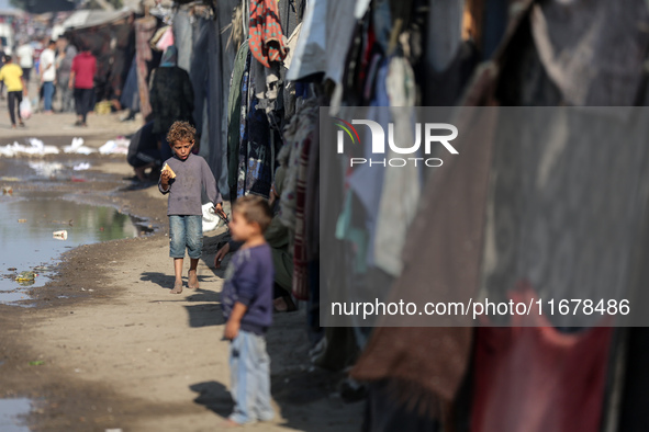 Displaced Palestinians are in Deir al-Balah in the central Gaza Strip on October 18, 2024, amid the ongoing war between Israel and the Pales...