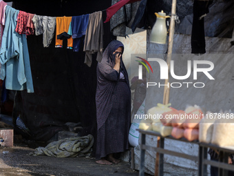 Displaced Palestinians are in Deir al-Balah in the central Gaza Strip on October 18, 2024, amid the ongoing war between Israel and the Pales...