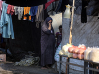 Displaced Palestinians are in Deir al-Balah in the central Gaza Strip on October 18, 2024, amid the ongoing war between Israel and the Pales...