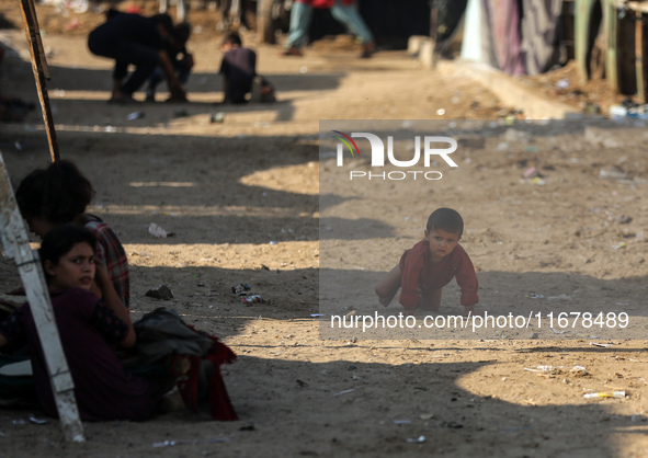 Displaced Palestinians are in Deir al-Balah in the central Gaza Strip on October 18, 2024, amid the ongoing war between Israel and the Pales...