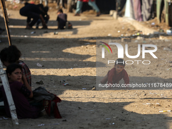 Displaced Palestinians are in Deir al-Balah in the central Gaza Strip on October 18, 2024, amid the ongoing war between Israel and the Pales...