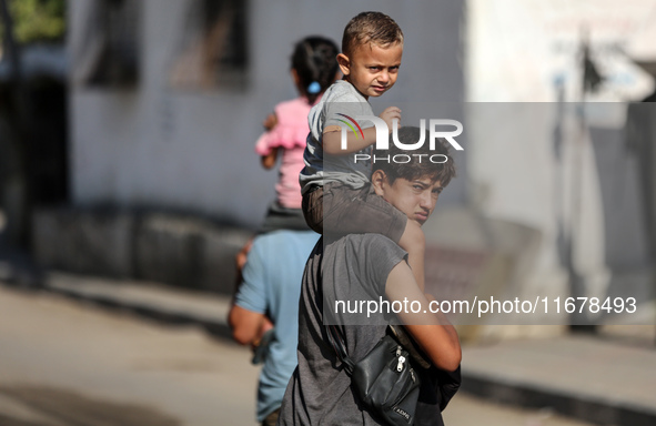 Displaced Palestinians are in Deir al-Balah in the central Gaza Strip on October 18, 2024, amid the ongoing war between Israel and the Pales...