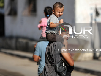 Displaced Palestinians are in Deir al-Balah in the central Gaza Strip on October 18, 2024, amid the ongoing war between Israel and the Pales...