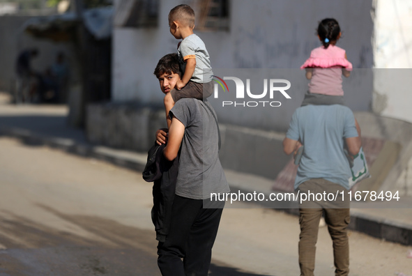 Displaced Palestinians are in Deir al-Balah in the central Gaza Strip on October 18, 2024, amid the ongoing war between Israel and the Pales...