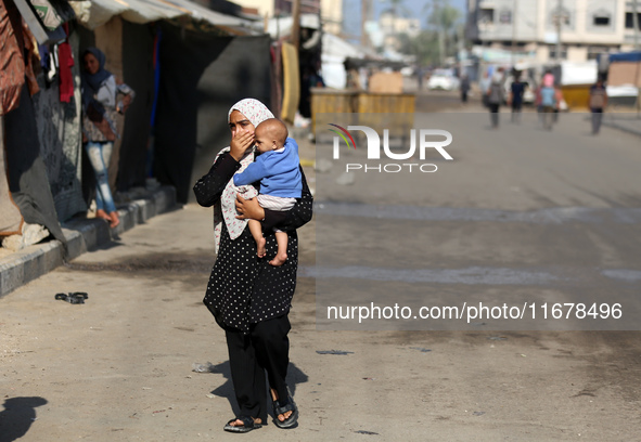 Displaced Palestinians are in Deir al-Balah in the central Gaza Strip on October 18, 2024, amid the ongoing war between Israel and the Pales...