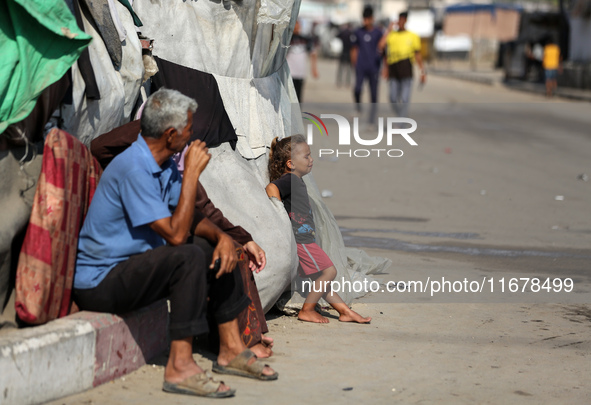 Displaced Palestinians are in Deir al-Balah in the central Gaza Strip on October 18, 2024, amid the ongoing war between Israel and the Pales...