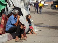 Displaced Palestinians are in Deir al-Balah in the central Gaza Strip on October 18, 2024, amid the ongoing war between Israel and the Pales...