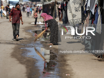 Displaced Palestinians are in Deir al-Balah in the central Gaza Strip on October 18, 2024, amid the ongoing war between Israel and the Pales...