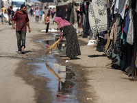 Displaced Palestinians are in Deir al-Balah in the central Gaza Strip on October 18, 2024, amid the ongoing war between Israel and the Pales...