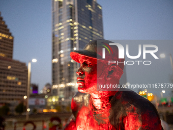 Spectators and participants are seen during the 2024 Blink Art and Light Festival in Cincinnati, Ohio, on October 17, 2024. (