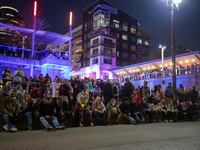 Spectators and participants are seen during the 2024 Blink Art and Light Festival in Cincinnati, Ohio, on October 17, 2024. (