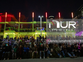 Spectators and participants are seen during the 2024 Blink Art and Light Festival in Cincinnati, Ohio, on October 17, 2024. (