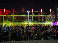 Spectators and participants are seen during the 2024 Blink Art and Light Festival in Cincinnati, Ohio, on October 17, 2024. (