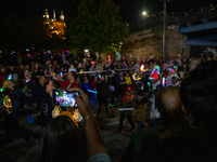 Spectators and participants are seen during the 2024 Blink Art and Light Festival in Cincinnati, Ohio, on October 17, 2024. (