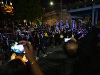 Spectators and participants are seen during the 2024 Blink Art and Light Festival in Cincinnati, Ohio, on October 17, 2024. (