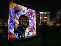 Spectators and participants are seen during the 2024 Blink Art and Light Festival in Cincinnati, Ohio, on October 17, 2024. (