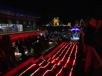 Spectators and participants are seen during the 2024 Blink Art and Light Festival in Cincinnati, Ohio, on October 17, 2024. (