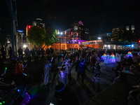 Spectators and participants are seen during the 2024 Blink Art and Light Festival in Cincinnati, Ohio, on October 17, 2024. (