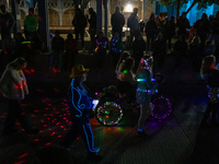 Spectators and participants are seen during the 2024 Blink Art and Light Festival in Cincinnati, Ohio, on October 17, 2024. (