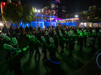 Spectators and participants are seen during the 2024 Blink Art and Light Festival in Cincinnati, Ohio, on October 17, 2024. (