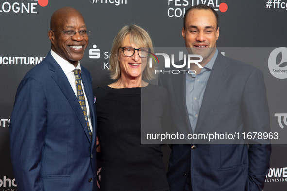 Edwin Moses, a former American hurdler, Anne Merrem, the mother of Julian Moses, and Julian Moses, the son of Edwin Moses, attend the screen...