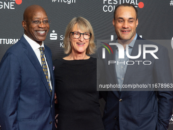 Edwin Moses, a former American hurdler, Anne Merrem, the mother of Julian Moses, and Julian Moses, the son of Edwin Moses, attend the screen...