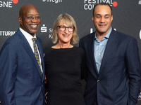 Edwin Moses, a former American hurdler, Anne Merrem, the mother of Julian Moses, and Julian Moses, the son of Edwin Moses, attend the screen...