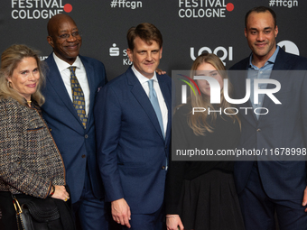 Edwin Moses, a former American hurdler, Ulrike Nasse-Meyfarth, Leopold Hoesch, and Julian Moses attend the screening of ''13 Steps - Die Ung...