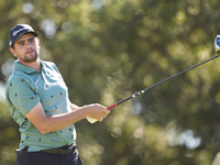 In San Roque, Spain, on October 18, 2024, Casey Jarvis of South Africa tees off on the 9th hole during the Estrella Damm N.A. Andalucia Mast...