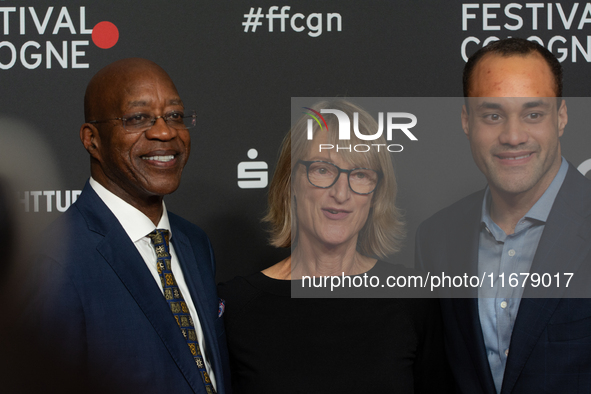 Edwin Moses, a former American hurdler, Anne Merrem, the mother of Julian Moses, and Julian Moses, the son of Edwin Moses, attend the screen...