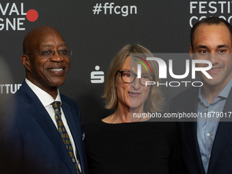 Edwin Moses, a former American hurdler, Anne Merrem, the mother of Julian Moses, and Julian Moses, the son of Edwin Moses, attend the screen...