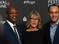 Edwin Moses, a former American hurdler, Anne Merrem, the mother of Julian Moses, and Julian Moses, the son of Edwin Moses, attend the screen...